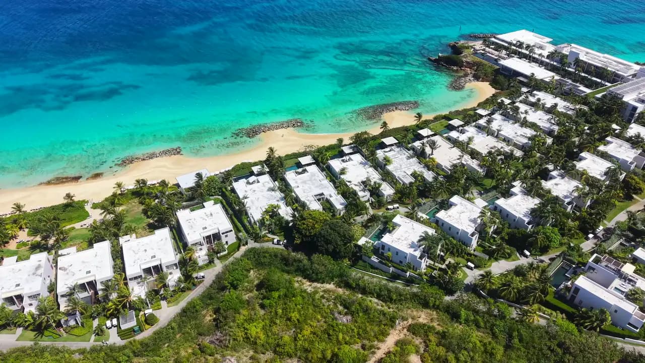 Beachfront villas on turquoise water
